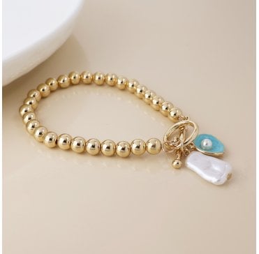 FAUX GOLD T BAR BRACELET WITH SHELL PEARL BEAD AND OYSTER CHARM