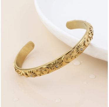 GOLD PLATED STAINLESS STEEL STAR AND MOON DEBOSSED BANGLE
