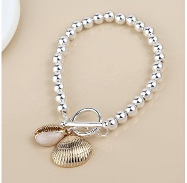 SILVER PLATED BEADED T BAR BRACELET WITH FAUX GOLD  CONCH AND CLAM SHELL CHARMS